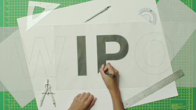 Person drawing WIPO acronym