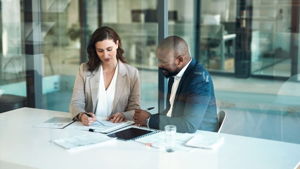 Business people reviewing document in an office