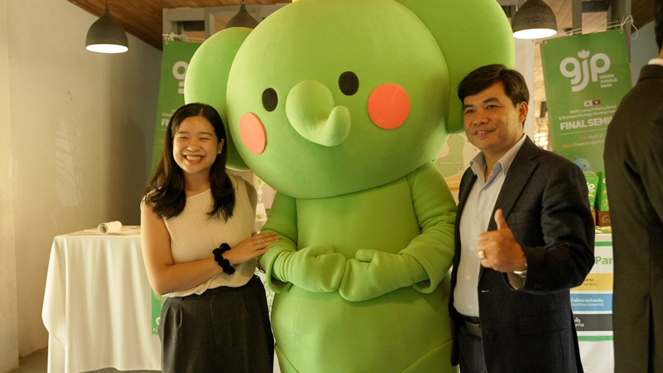 Mr. Akhom and his daughter with the Green Jungle Park’s mascot