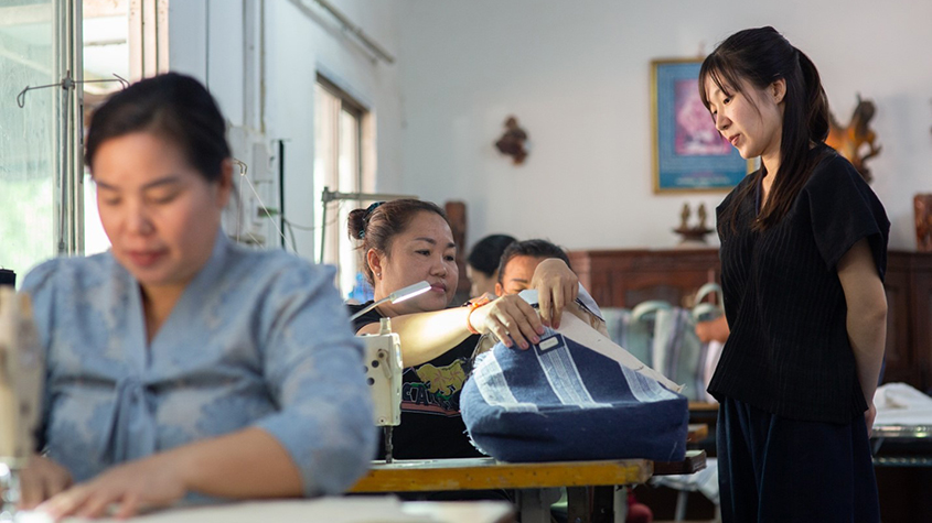 Douangmany works with her sewers to transform clothes into daily usable products
