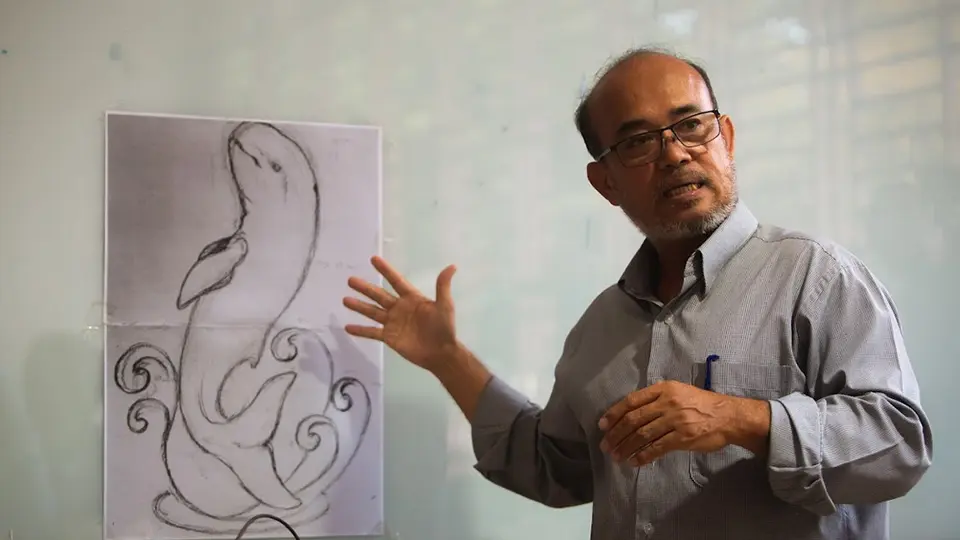 Prof. Tuot Bunchheang, Cambodian sculptor and teacher, teaching a drawing class at the Faculty of Fine Art