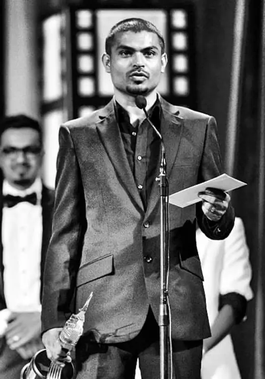 Ravee Farooq winning a film award for Ingili