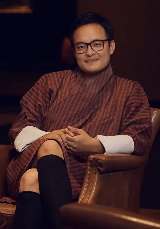 TheLungten sitting in traditional Bhutanese attire