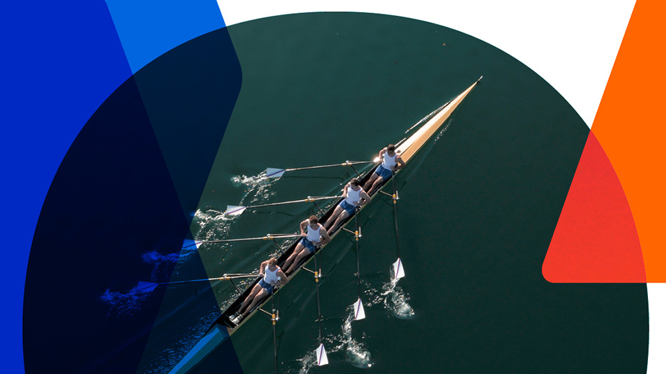 Athletes rowing on the water